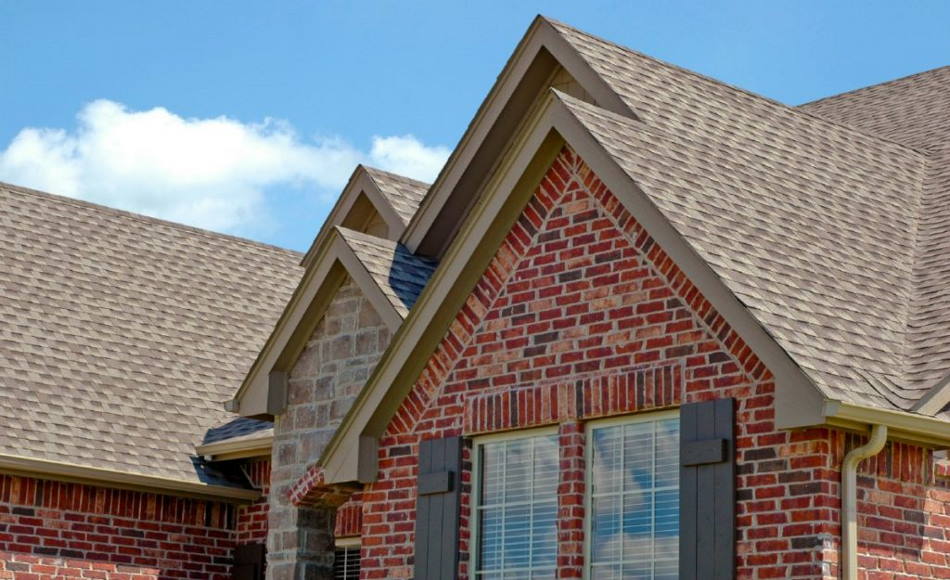 Roofing system with reliable and quality materials. Shows brown shingles on fields and ridges.