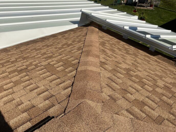 After photo — Sandy Rivett - Newly installed roof with awning in Canton of rdige