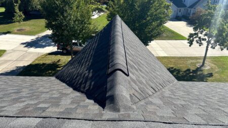 New GAF Timberline Natural Shadow roof in Appalachian Sky installed on Novi home with matching ridge cap shingles and balanced ridge ventilation.