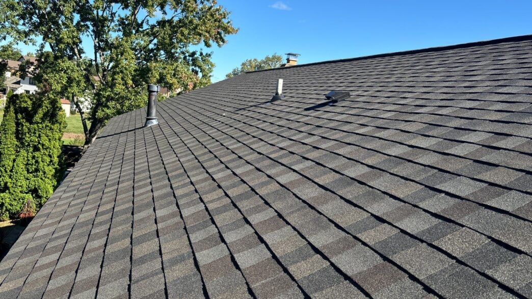 Wide view of newly installed GAF Timberline Natural Shadow shingles on Novi roof replacement project.