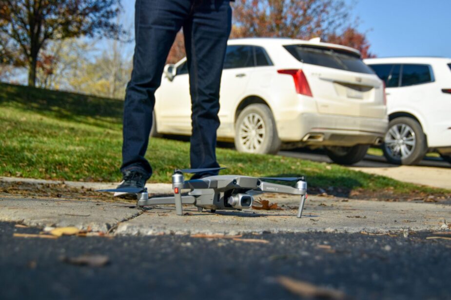 Drone inspection for roof health check. Drone on the ground, ready for takeoff.