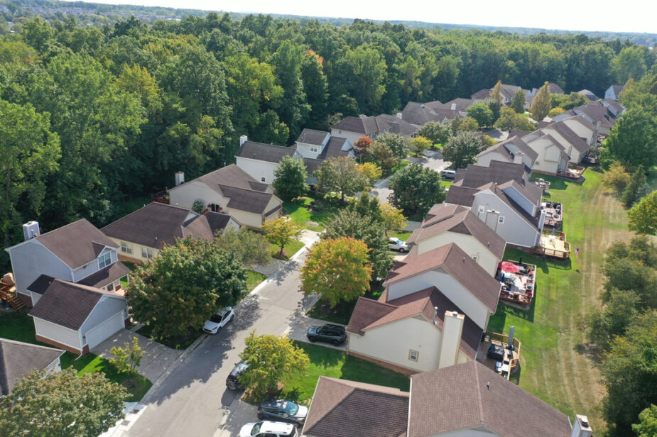 Maple Heights of Novi community project. Aerial view of a residential neighborhood with houses, trees, and green spaces in Novi, Michigan.