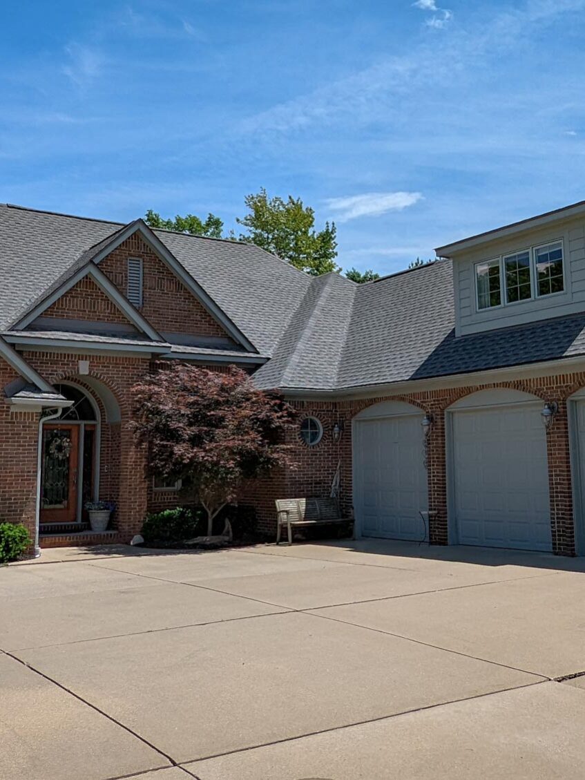 New Baltimore home with roof replacement, front view.