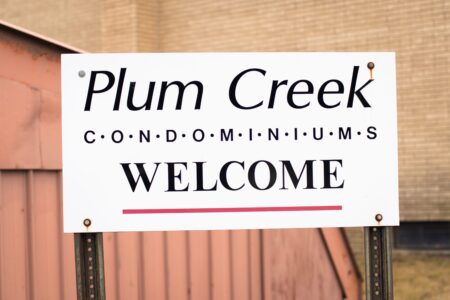 Community sign for Plum Creek Condos