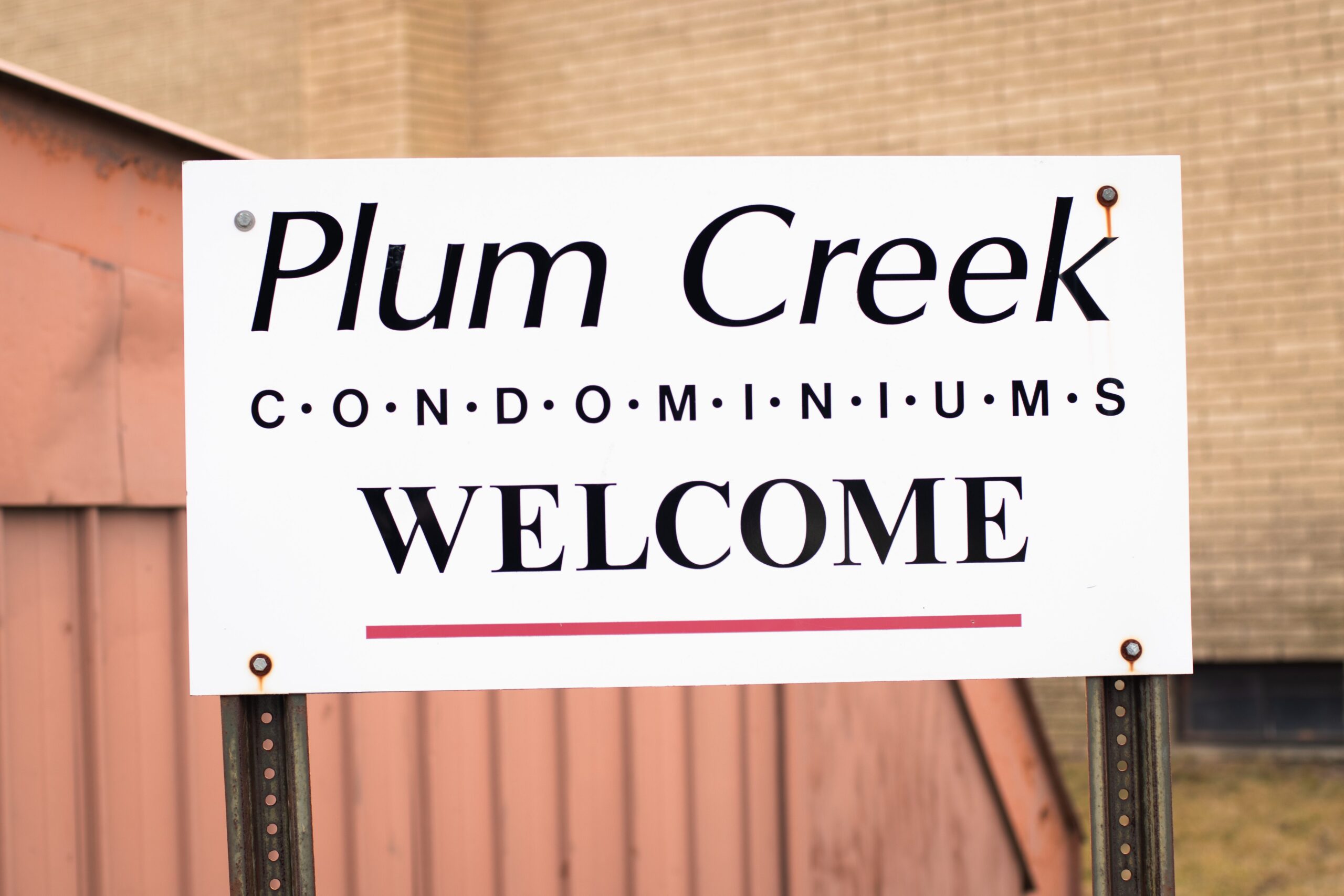 Community sign for Plum Creek Condos