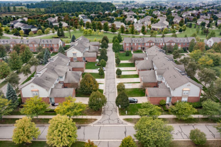 Aerial view of a Virginia hamlet neighborhood showing residential rooftops and surrounding landscape