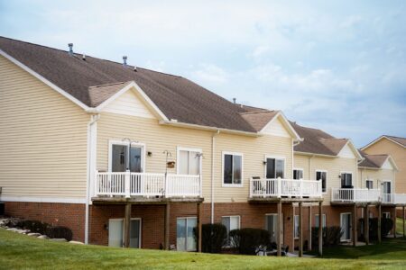 Woodruff Lake Shore Project Updates: View of apartment building rooftops and balconies. Showcasing the latest roofing updates at Woodruff Lake Shore.