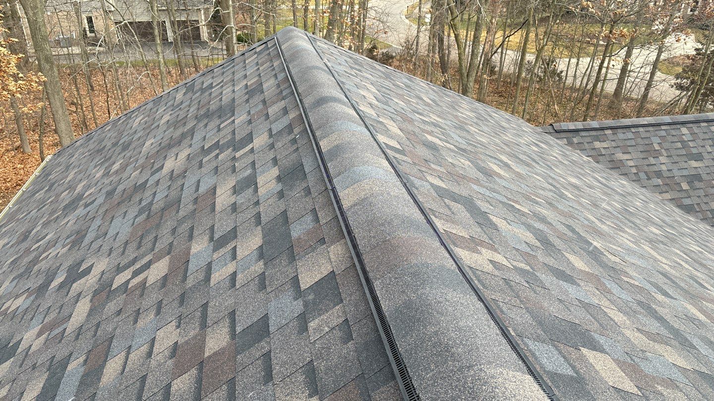 After roof replacement in Brighton, MI, showing a home with newly installed shingles on the roof