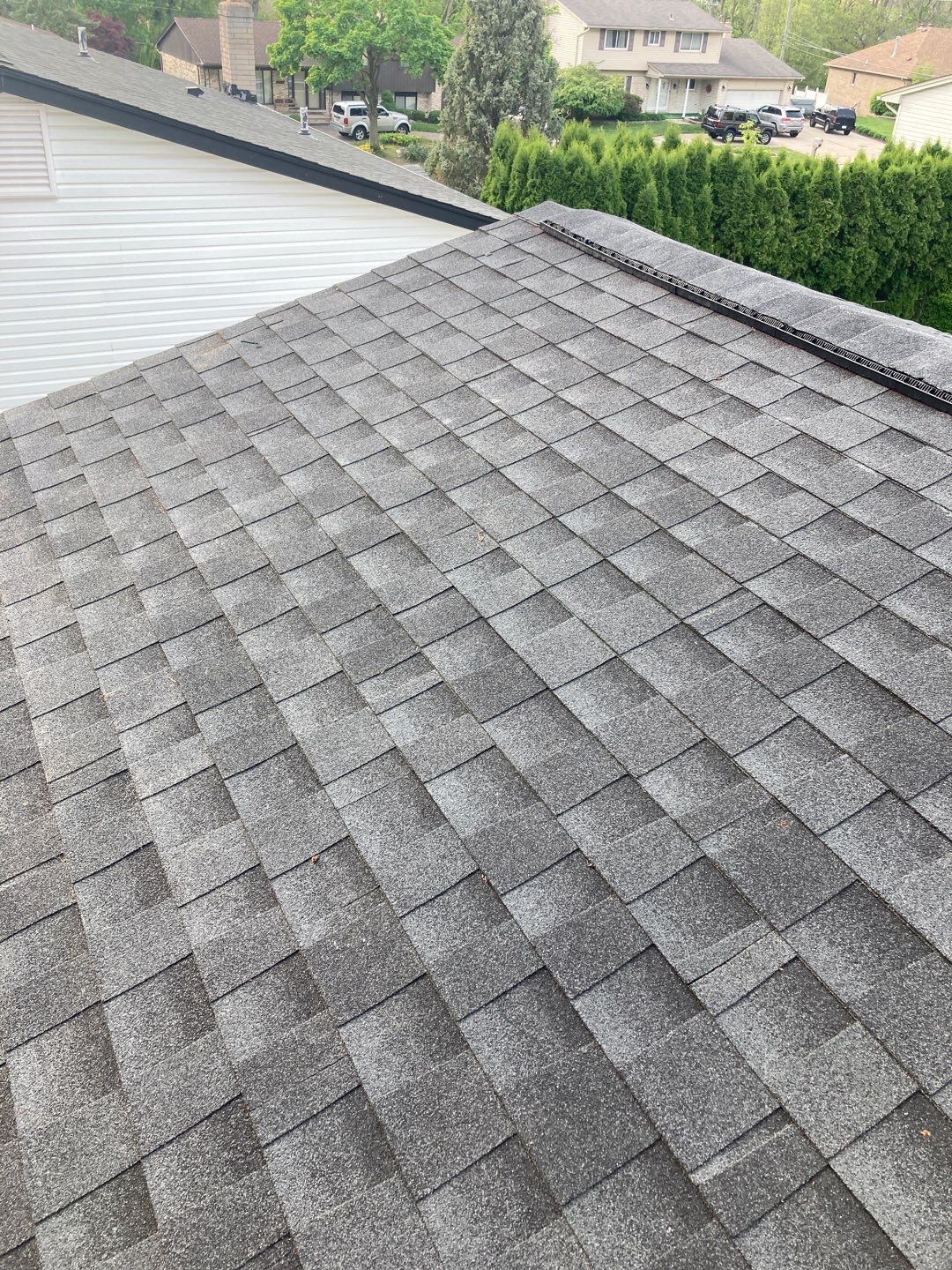 Andrea M.'s new 5-Star Roofing in Clinton Township shines! Gray asphalt shingles offer durability & curb appeal. Expert roofing services for lasting protection.