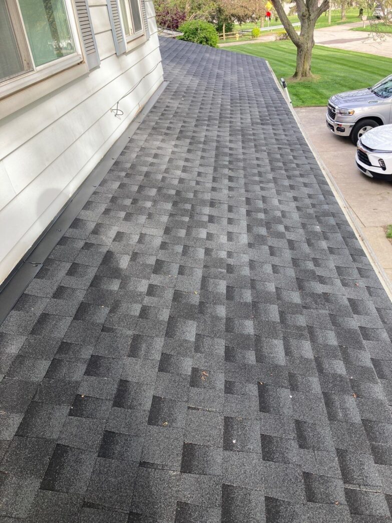 Andrea M's new 5-Star Roofing in Clinton Township. The after image showcases the quality of the roofing work by 5-Star Roofing. The result is impressive.
