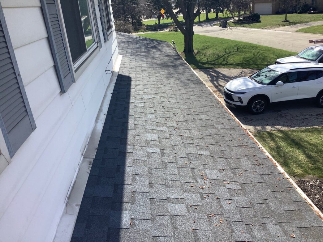 Andrea M's 5-Star Roofing project in Clinton Twp: Before photo showing the existing roof shingles prior to roof replacement. Quality roofing services.