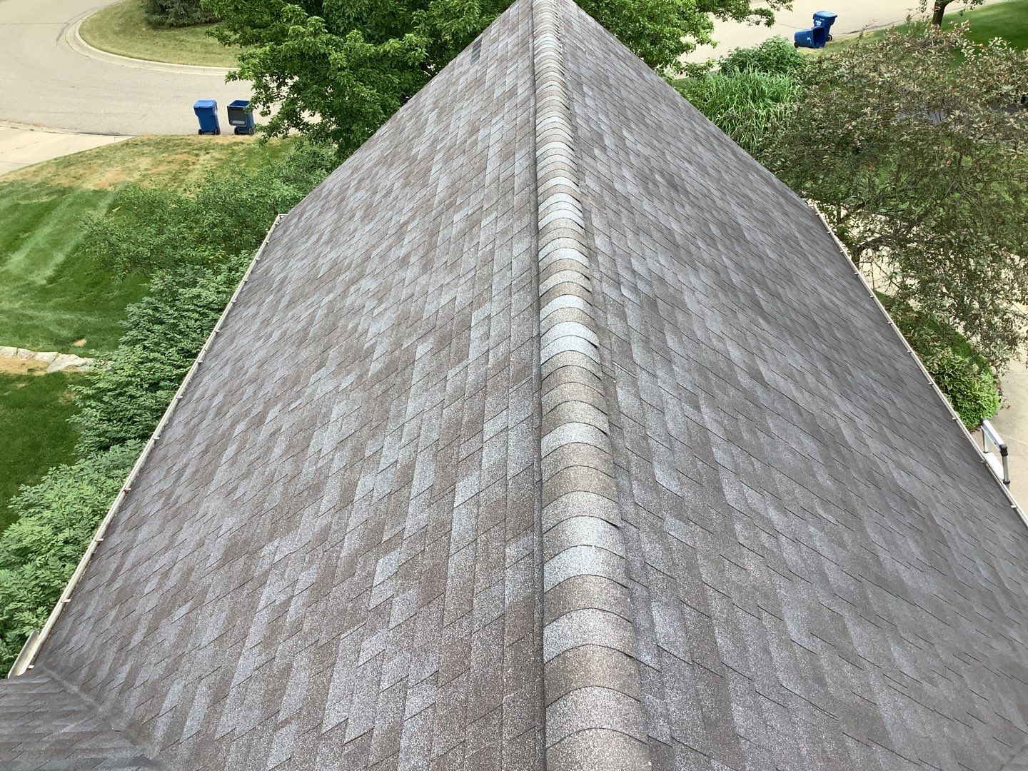 Ann Arbor home exterior before roofing project, documenting existing roof condition for Laurie Morgan