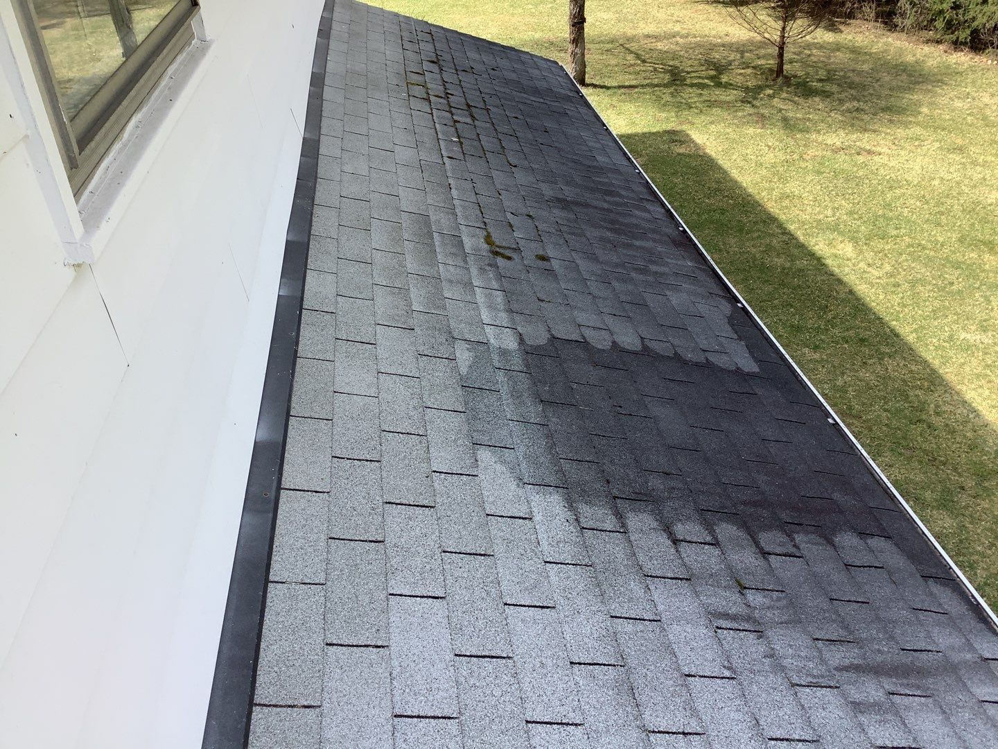 Before photo of Bill's Ann Arbor roof showing weathered shingles needing replacement. This asphalt shingle roof is showing its age and is ready for replacement.