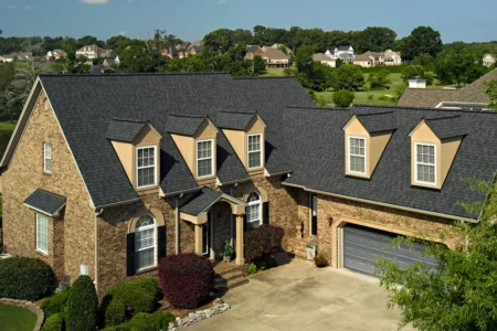 CertainTeed Landmark Pro roofing shingles on a brick house in MI. Showing roofing shingle options for homes. Durable, stylish roofing for Michigan homes.
