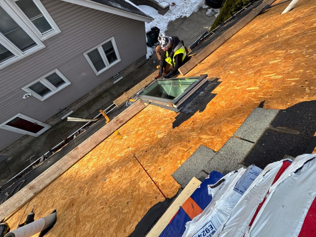Dan Oshea's 5-Star Roofing team installs a skylight during a roof replacement in Royal Oak. View the process of our top-rated roofing services.