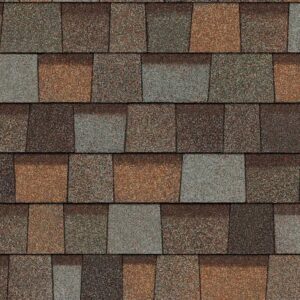 Owens Corning Duration Designer Shingles in Aged Copper. Roofing material with a blend of brown, grey and copper tones for a distinctive, durable roof.
