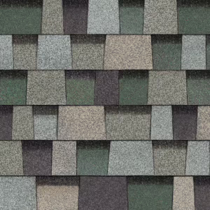 Close-up of Owens Corning Duration Designer Shingles in Evergreen Mist. Roofing material texture showcases varied green and gray tones for a natural look.