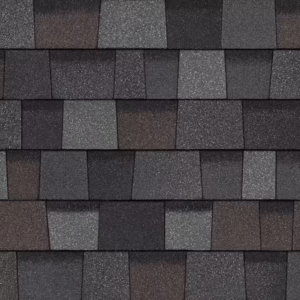 Owens Corning Duration Designer Shingles in Gray Tweed: A close-up showcasing the varied gray tones and textured surface of the designer shingles. 