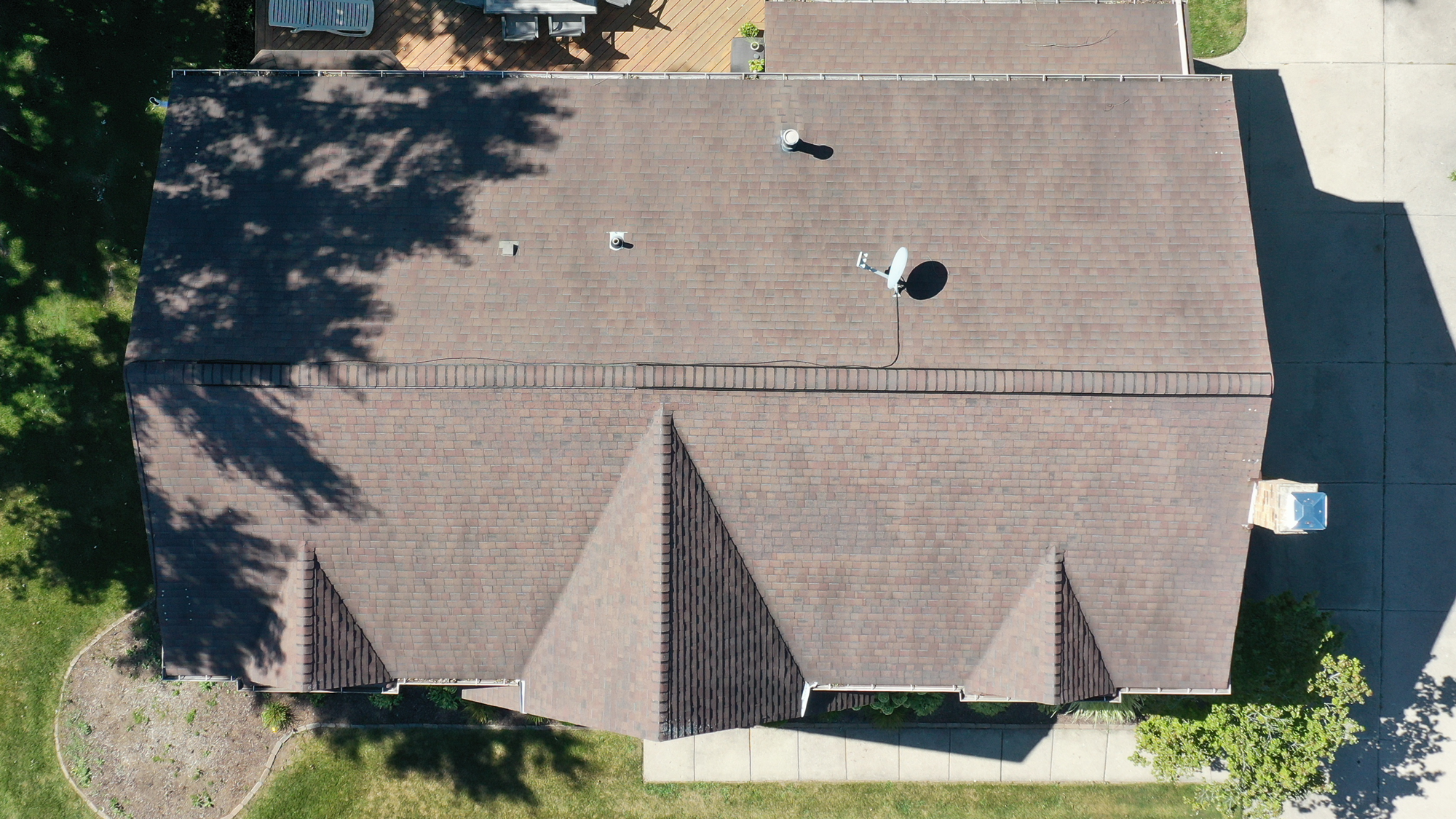 Before roof replacement in Novi, MI, as seen from above. Get a RoofAdvisor expert to assess your roof's condition and replacement needs today. 