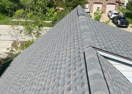 Post-roof replacement in New Baltimore, showcasing a pristine gray shingle roof with a clean, finished field, highlighting the quality of the roofing work.