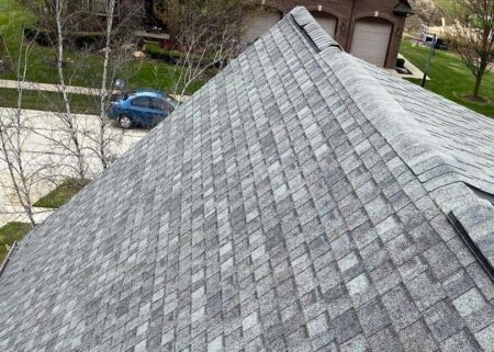 Before roof replacement in New Baltimore. An aerial view of an old roof shows signs of wear and tear, signaling the need for a roof replacement.