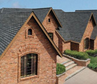 GAF Designer Slateline roofing example. Antique slate color slateline roof on brick house. Architectural detail with brickwork around windows.