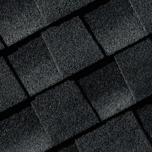 Close-up of GAF Timberline AS II shingles. Asphalt roofing material with a textured surface. Dark gray/black color. Exceptional depth and all the beauty you could want with extra protection for your most valuable asset