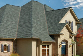 GAF Timberline roofing system ArmorShield II example roof in slate. Asphalt shingles on a luxury home. Roofing material with shadow lines for a natural look.