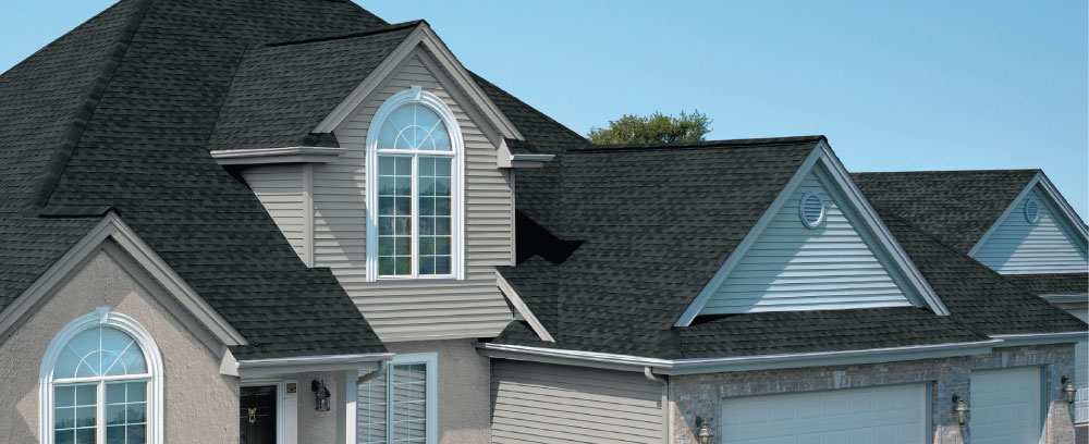 GAF Timberline Natural Shadow Shingles on a house roof. Asphalt shingles with a natural shadow effect create a dimensional look for roofing.