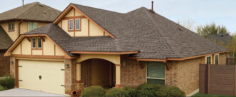 GAF Timberline UHDZ Shingles in Barkwood on a home. Asphalt roofing shingles with a wood-shake look. Durable, ultra high definition zone shingles.