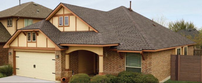 GAF Timberline UHDZ Shingles in Barkwood on a home. Asphalt roofing shingles with a wood-shake look. Durable, ultra high definition zone shingles.