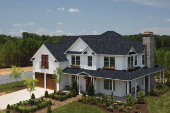Grand Manor by CertainTeed in Black Pearl: A distinguished home featuring a luxurious CertainTeed Grand Manor roof, showcasing elegance and durability.