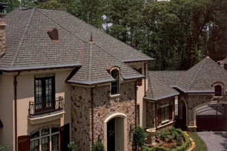 Grand Manor Gatehouse Slate Shingles on a home showcasing premium roofing. The architectural shingles adds elegance and protection to the residence.
