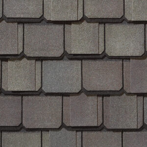 Grand Manor by CertainTeed gatehouse slate roofing shingles. Close-up shows textured, layered design, enhancing home exteriors with durable, stylish protection.