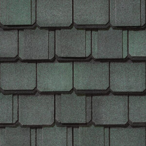 Grand Manor by CertainTeed roofing shingles in Sherwood Forest color. Close-up view of premium asphalt roofing with a distinct, scalloped design.