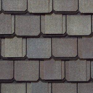 Grand Manor Weathered Wood shingles by CertainTeed. Close-up of roofing material showing color and texture. Durable roofing with a classic look.