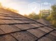 Home roofing warranty guide: Close-up of asphalt shingles on a home roof, overlaid with warranty icons, for homeowners' peace of mind in 2026.