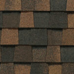 CertainTeed Landmark Pro Max Def Burnt Sienna roofing shingles showcasing a blend of dark brown and burnt sienna tones in a close-up, textured pattern.