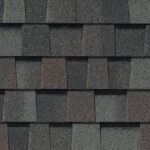 CertainTeed Landmark Pro Max Def Colonial Slate shingles. Roofing material showing a mix of dark grays and subtle red tones in a classic slate pattern.