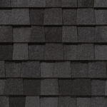 Landmark Pro roofing shingles by CertainTeed in Max Def Moire Black color. Close-up of durable roofing material. High-quality roofing texture.