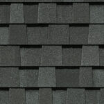 Close-up of CertainTeed Landmark Pro Max Def Pewter shingles. Asphalt roofing material in a dark gray, textured pattern. Durable and weather-resistant.