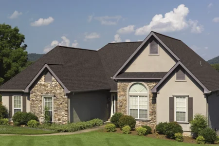 Landmark Pro by CertainTeed roofing on a home with stone accents, showcasing mdespr-render-2206 style. A durable, aesthetic choice for residential roofing.