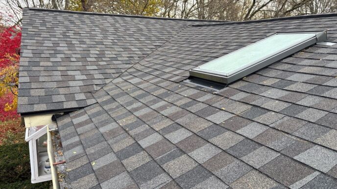 5-Star Roofing: Leila A's Redford home with a newly installed roof and skylight. Quality craftsmanship by 5-Star Roofing. Durable, reliable roofing.