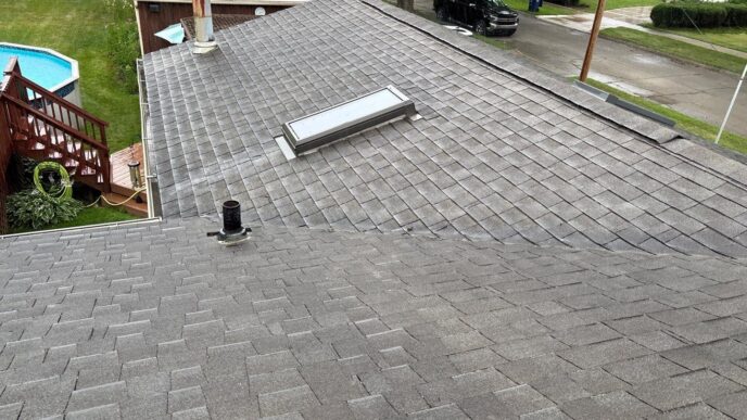 Leila A's Redford home before 5-Star Roofing's services: shows an aging roof with visible wear and tear, highlighting the need for roof replacement.