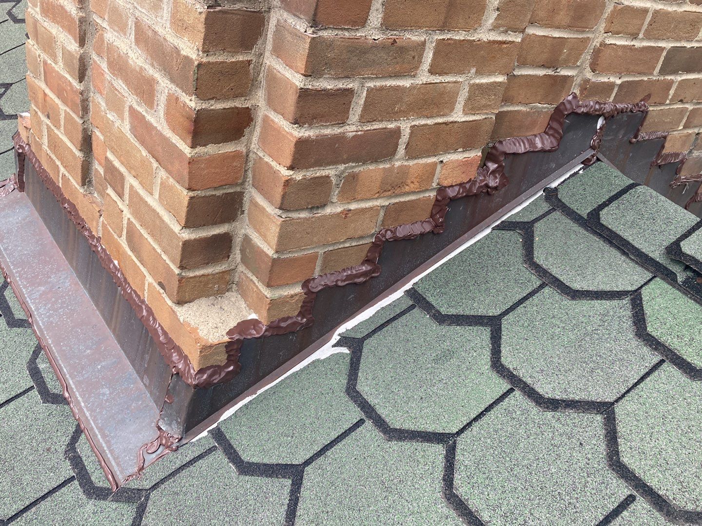 Another shot of the flashing on the chimney of Lori's Plymouth home after roof repair.