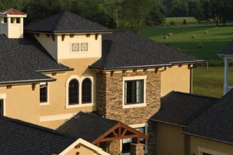 Northgate Max Def Moire Black shingles on a home. Durable roofing with a stylish, dimensional design. Enhancing curb appeal and protection.