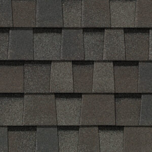Close-up of CertainTeed NorthGate MaxDef Driftwood asphalt shingles. Roofing material with a textured surface and varied shades of brown and gray.