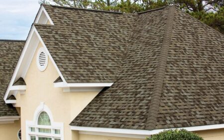Owens Corning Duration Shingles in Driftwood color on a residential roof. High-quality roofing material for durable and aesthetic home protection.