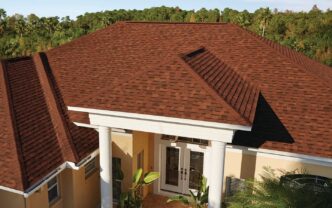 Owens Corning Duration Shingles in Terra Cotta color on a residential roof. Shows the texture and color variation of the roofing material. House exterior.