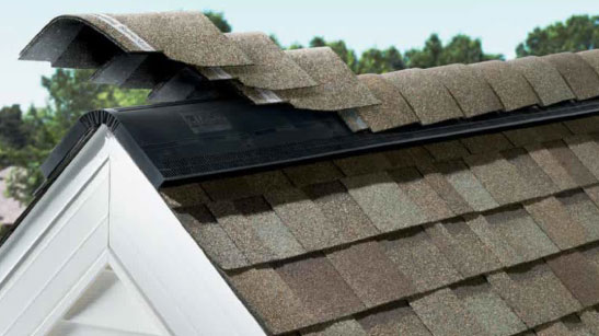Owens Corning Hip Ridge Shingles installed on a roof, showcasing their layered design and weather protection. Part of the total protection roofing system